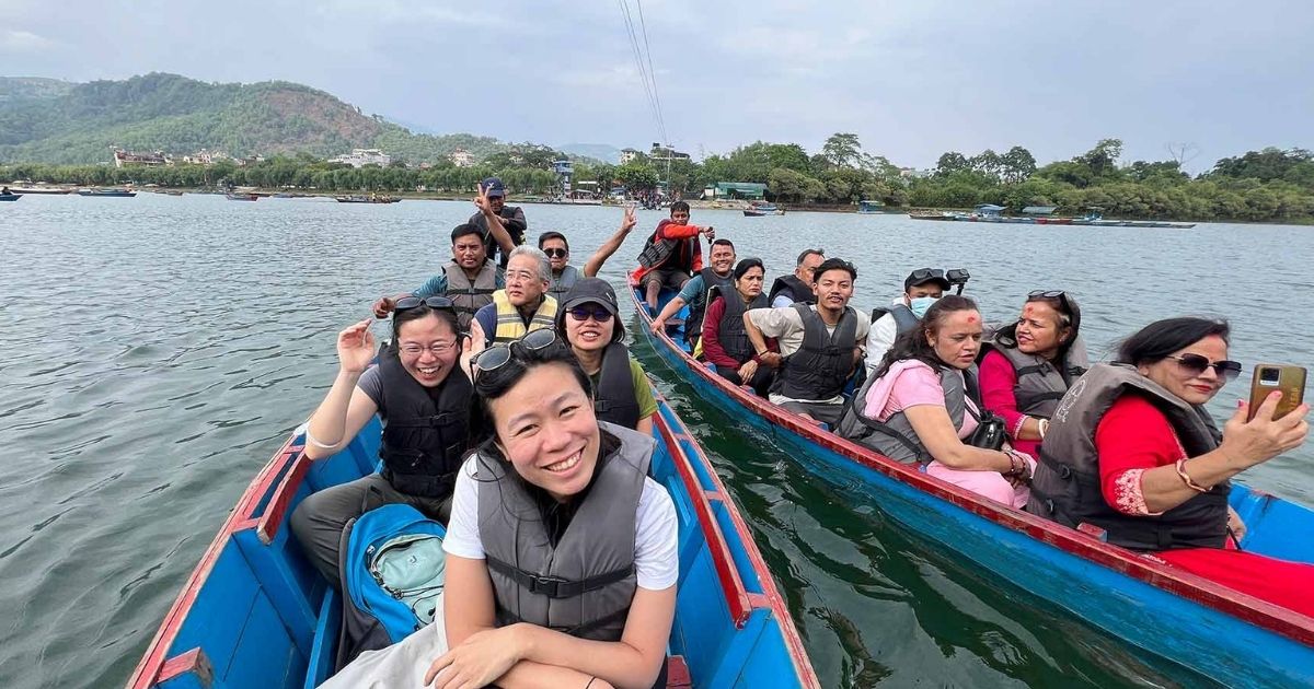 Riding a boat on Phewa Lake
